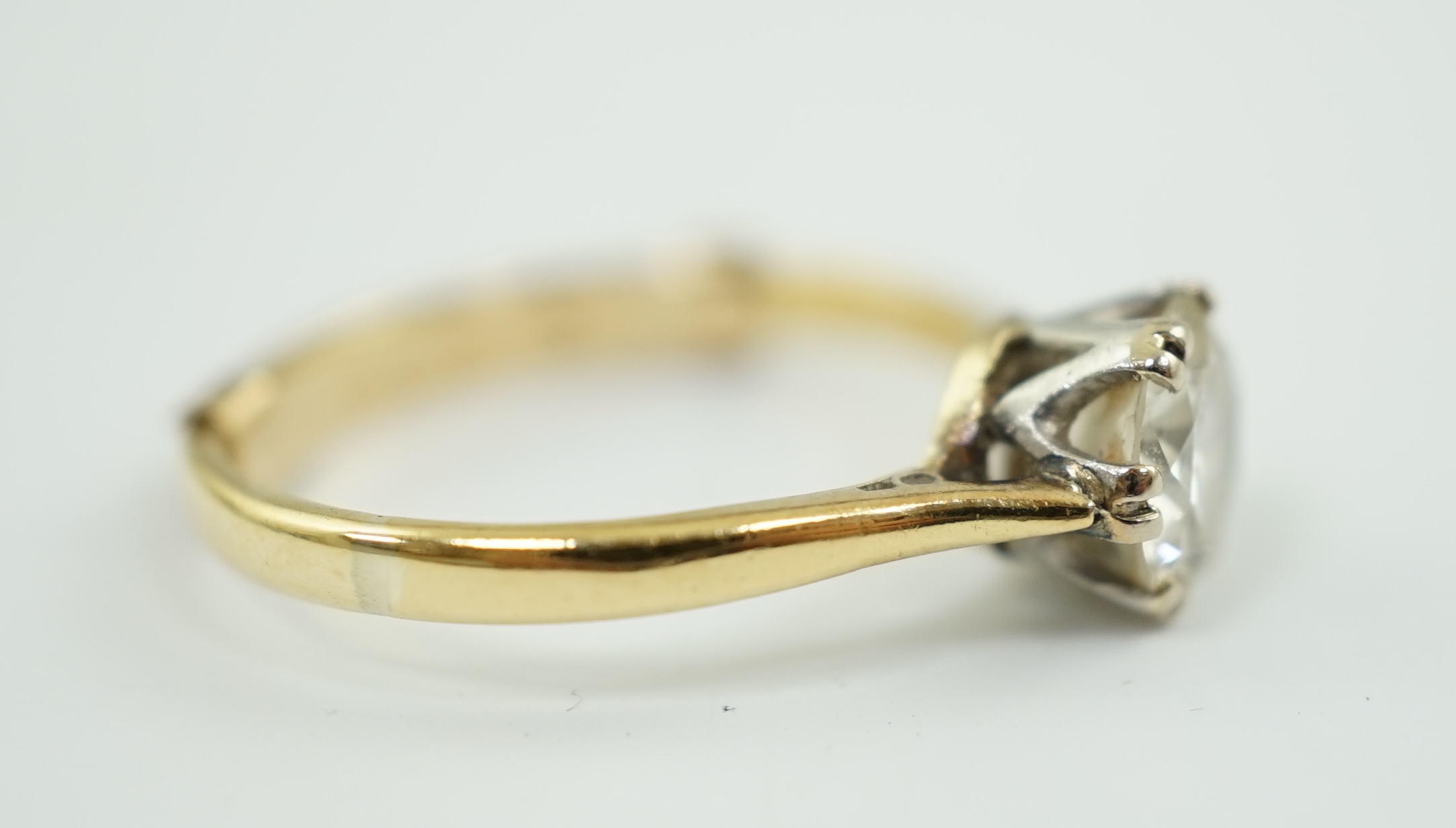 A gold and solitaire diamond set ring